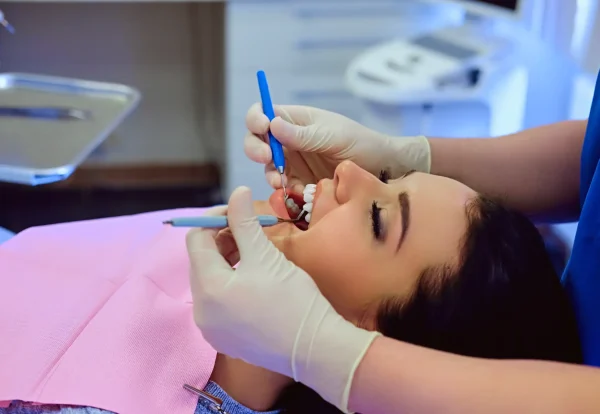 close-up-image-dentist-examining-female-s-teeth-dentistry