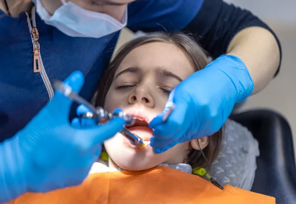 young-woman-is-giving-anesthesia-tooth-dental-treatment-concept